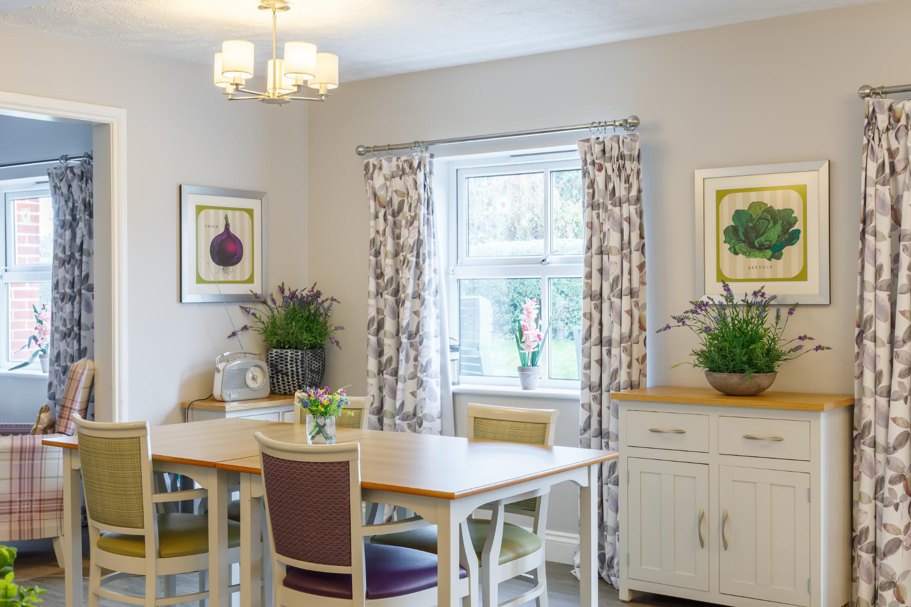 dining room with floral textiles and plants